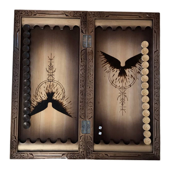 Wooden backgammon board featuring raven motif