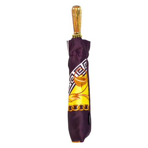 Folding umbrella in plum color with ornamental design
