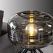 Sleek Tripod Base Glass Table Lamp with Contemporary Design