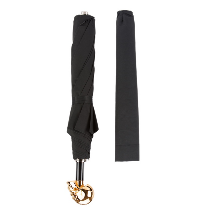 designer black umbrella with gold skull handle