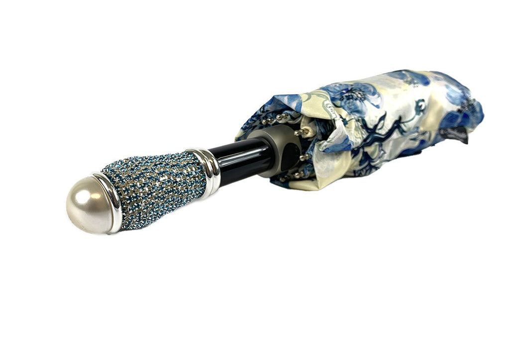 Stylish folding umbrella with delicate blue poppies