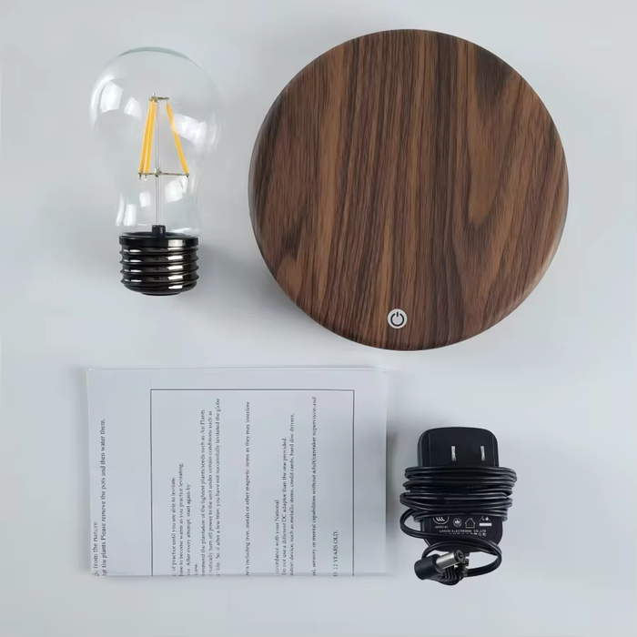 Luxury office desk with floating Edison lamp, MacBook, notebook and coffee
