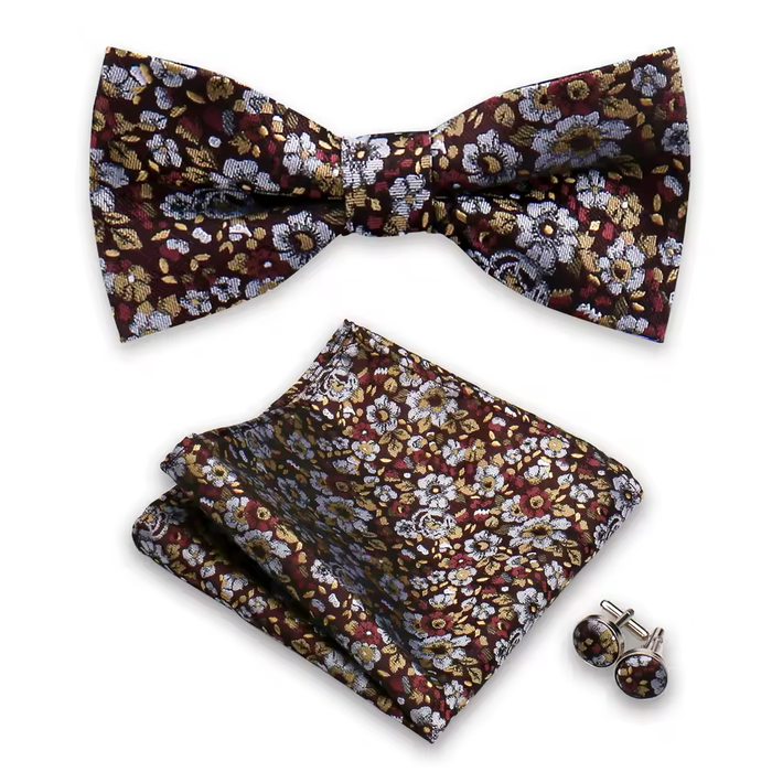 Floral bow tie, pocket square, and cufflinks set on a white background